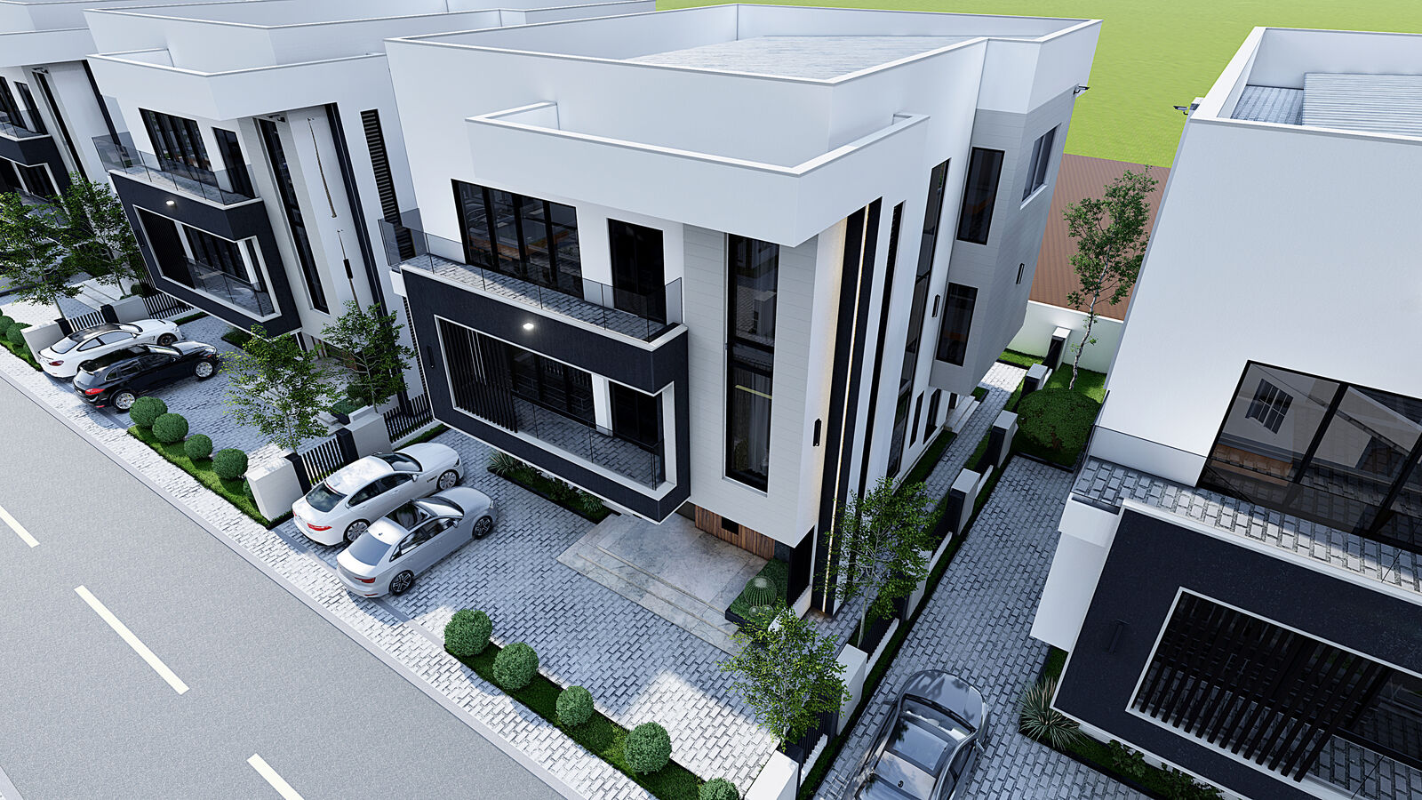 Aerial view of an estate corner plot with paved parking and green setback