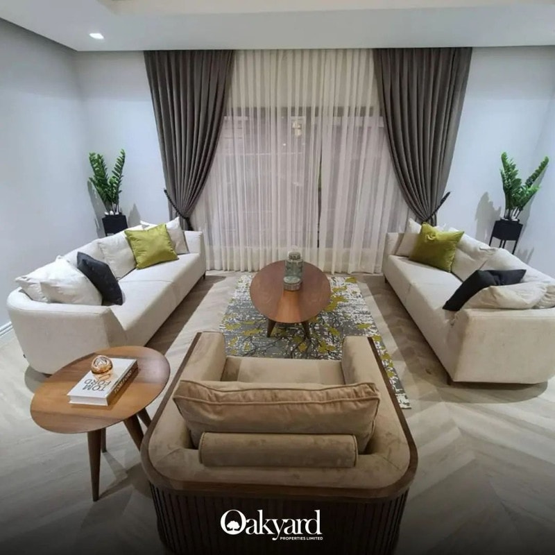 Twin sofas and a round centre table in a finished living room