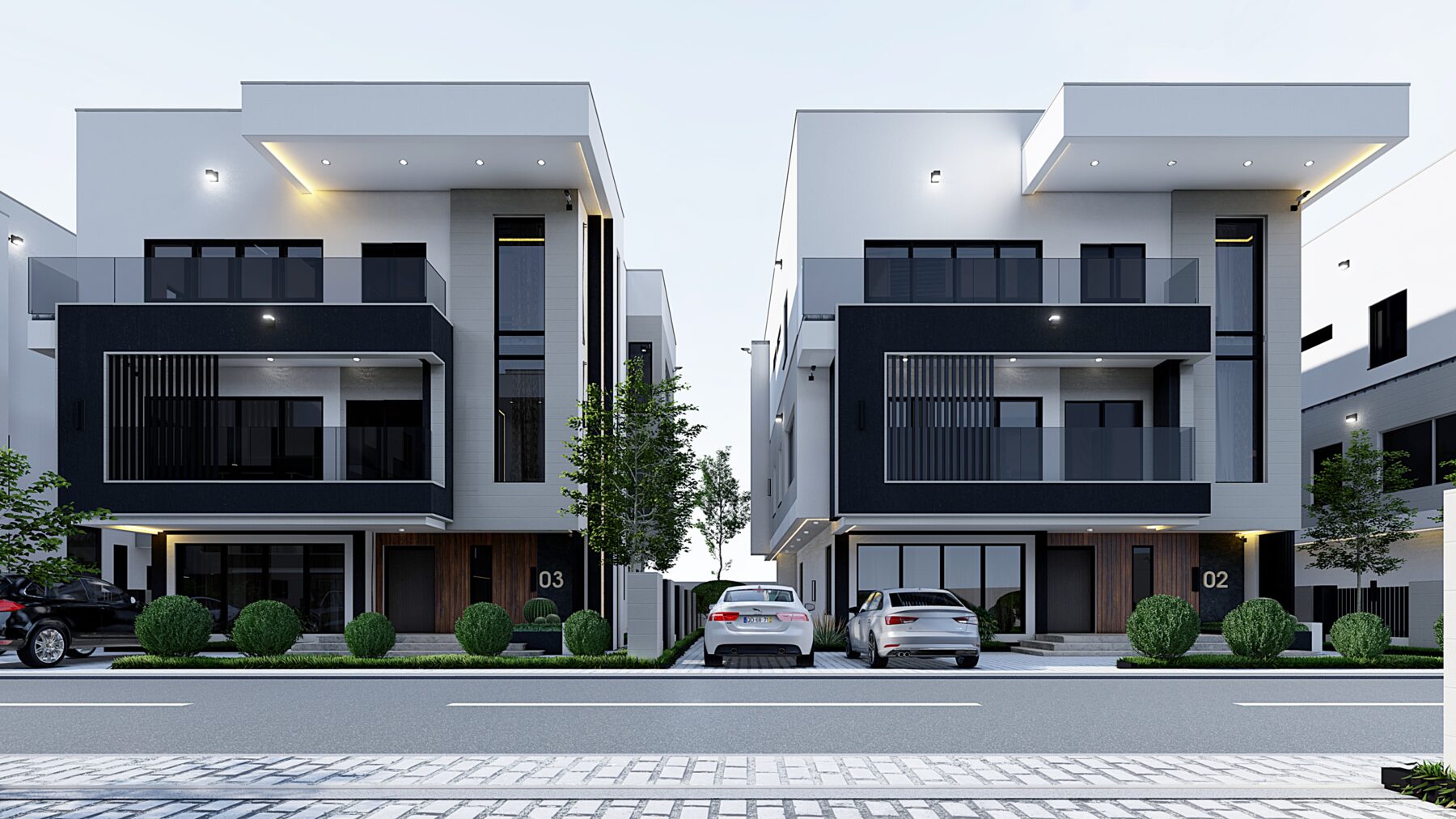 Orchid Vista — a pair of contemporary white and charcoal duplexes facing a paved road